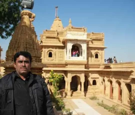 Ramapada Acharjee at a historic stone temple complex during his spiritual research tour
