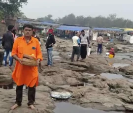 Ramapada Acharjee offering sacred prayers and rituals at a holy river ghat