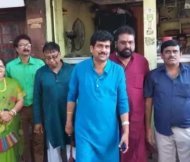 Ramapada Acharjee with professional colleagues and spiritual practitioners during a community gathering