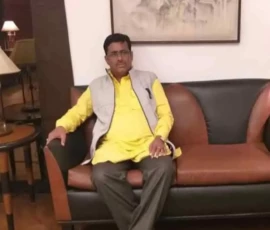 Professional astrology consultant Ramapada Acharjee in a composed and reflective posture