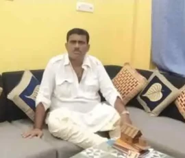 Astrologer Ramapada Acharjee in a relaxed and welcoming posture before giving a personal consultation session
