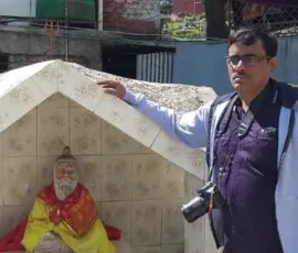 Ramapada Acharjee paying respect to a spiritual saint during his religious travels
