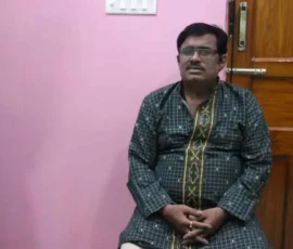 Astrologer Ramapada Acharjee in a serene and meditative pose during a spiritual session