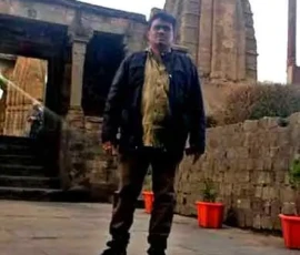 Ramapada Acharjee exploring ancient Vedic temple heritage during a spiritual tour