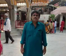 Astrologer Ramapada Acharjee at a sacred temple premises during his spiritual tour