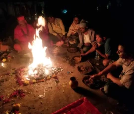 Astrologer Ramapada Acharjee performing deep spiritual Yagna and Havan rituals at night