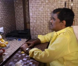 Astrologer Ramapada Acharjee providing spiritual consultation at his professional chamber