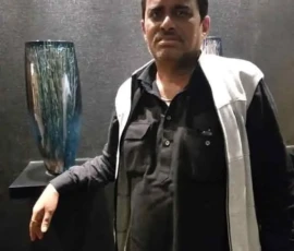 Professional spiritual consultant Ramapada Acharjee in stylish attire during an international tour