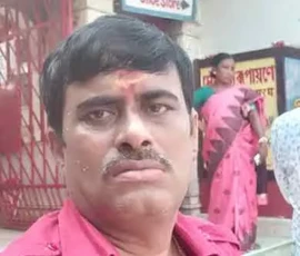 Astrologer Ramapada Acharjee during a spiritual visit to a sacred temple complex