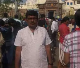 Astrologer Ramapada Acharjee at the grand entrance (Singhadwara) of Jagannath Temple, Puri